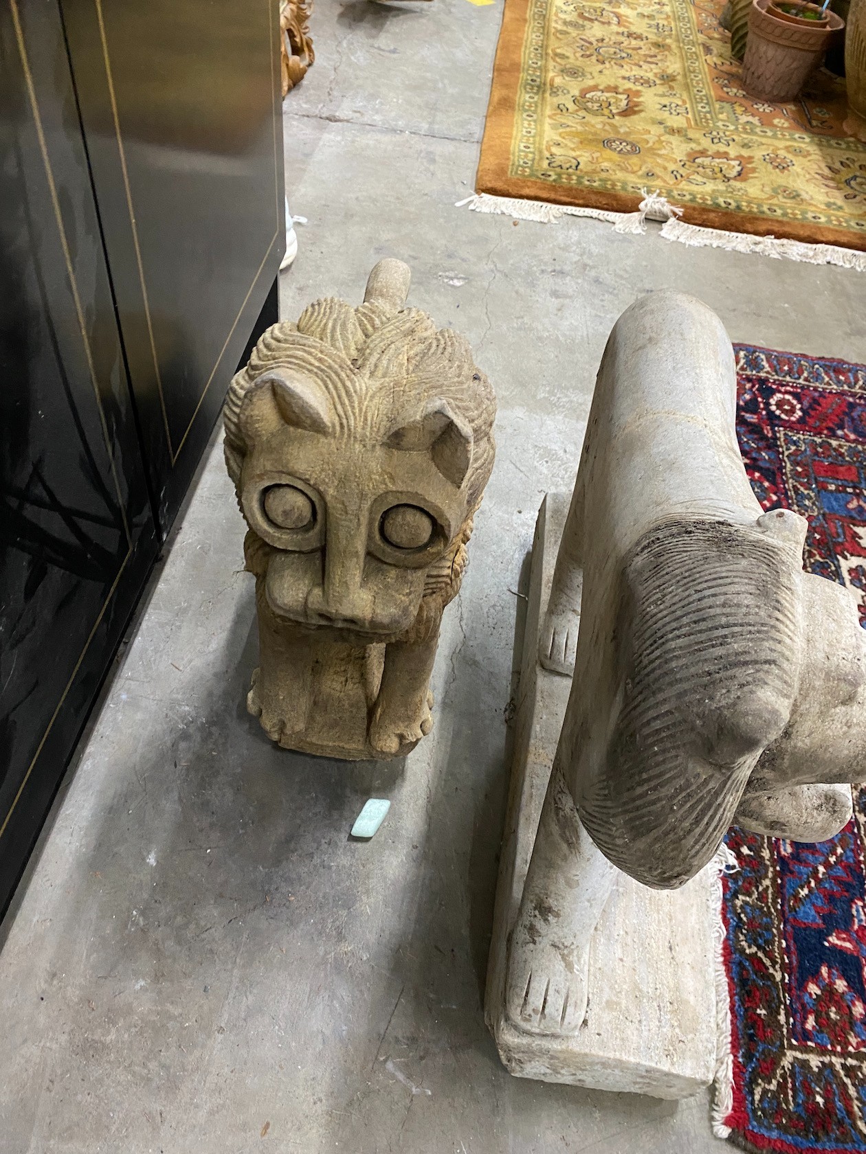 Two stone carvings, larger height 49cm